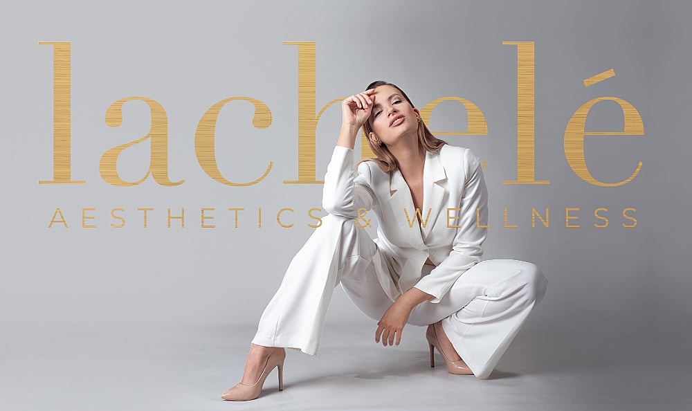 Woman in white suit promoting aesthetics and wellness.