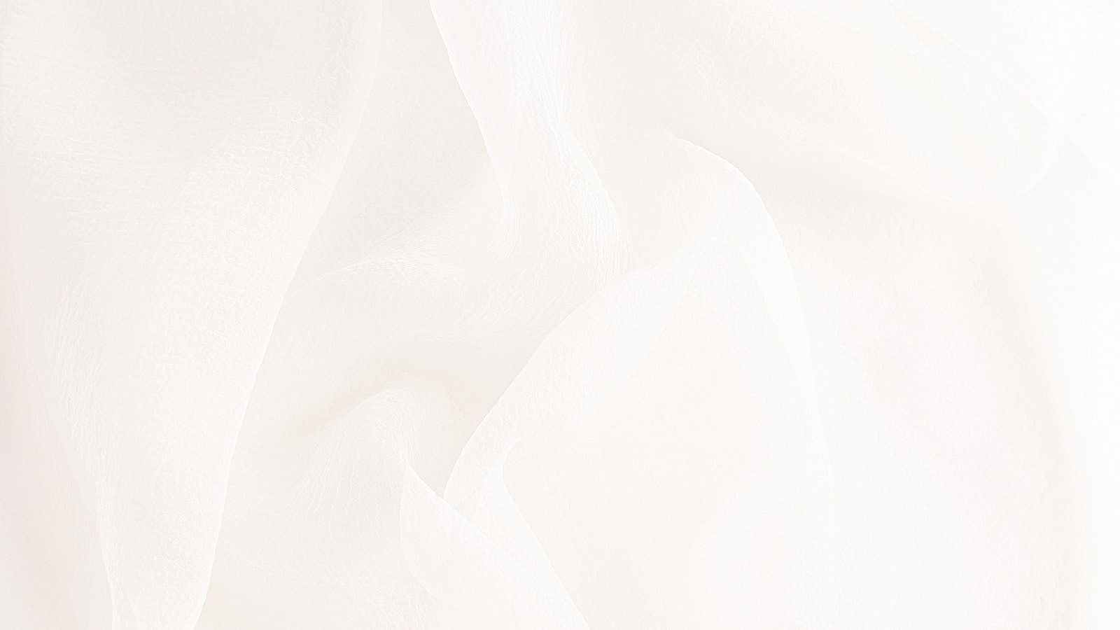 Soft, flowing white fabric texture background.