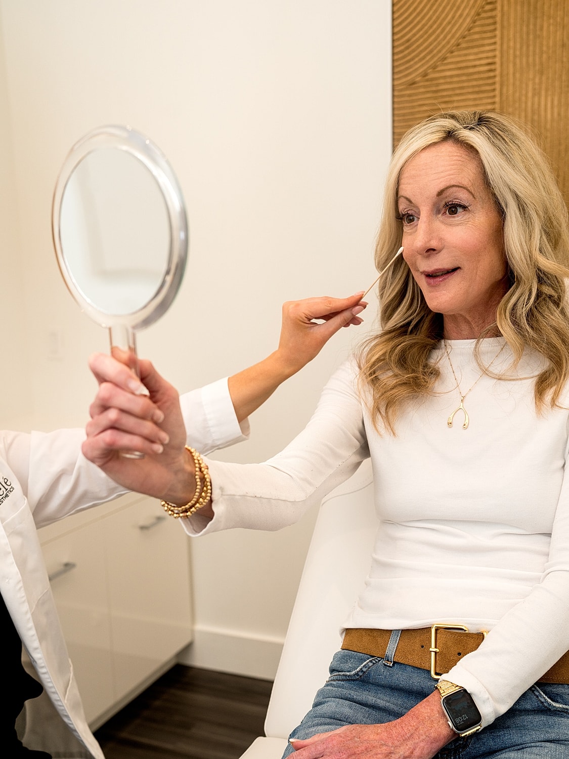 Medical professional preparing patient for procedure.