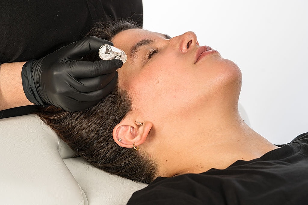 Medical professional preparing patient for procedure.