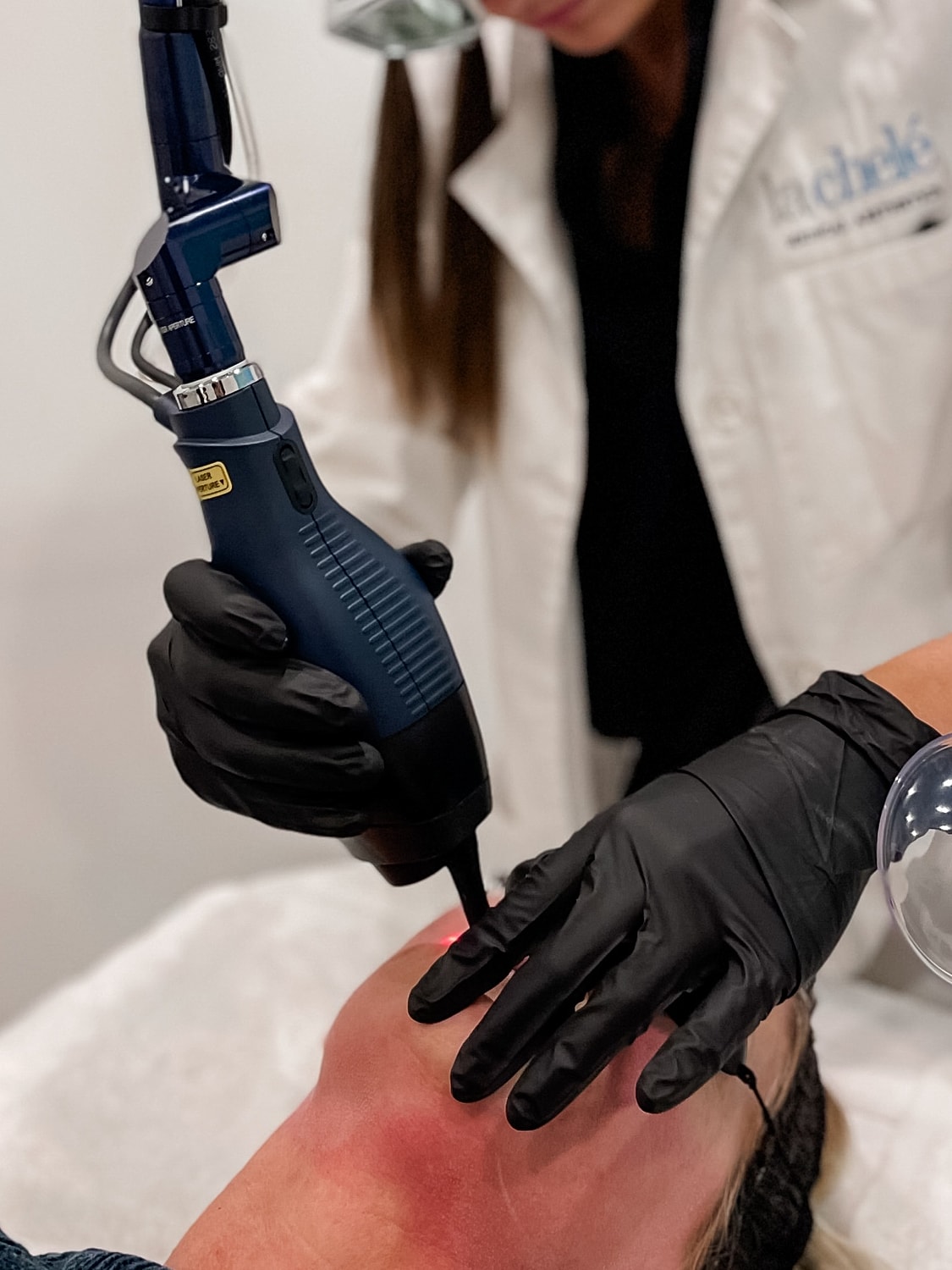 Medical professional preparing patient for procedure.