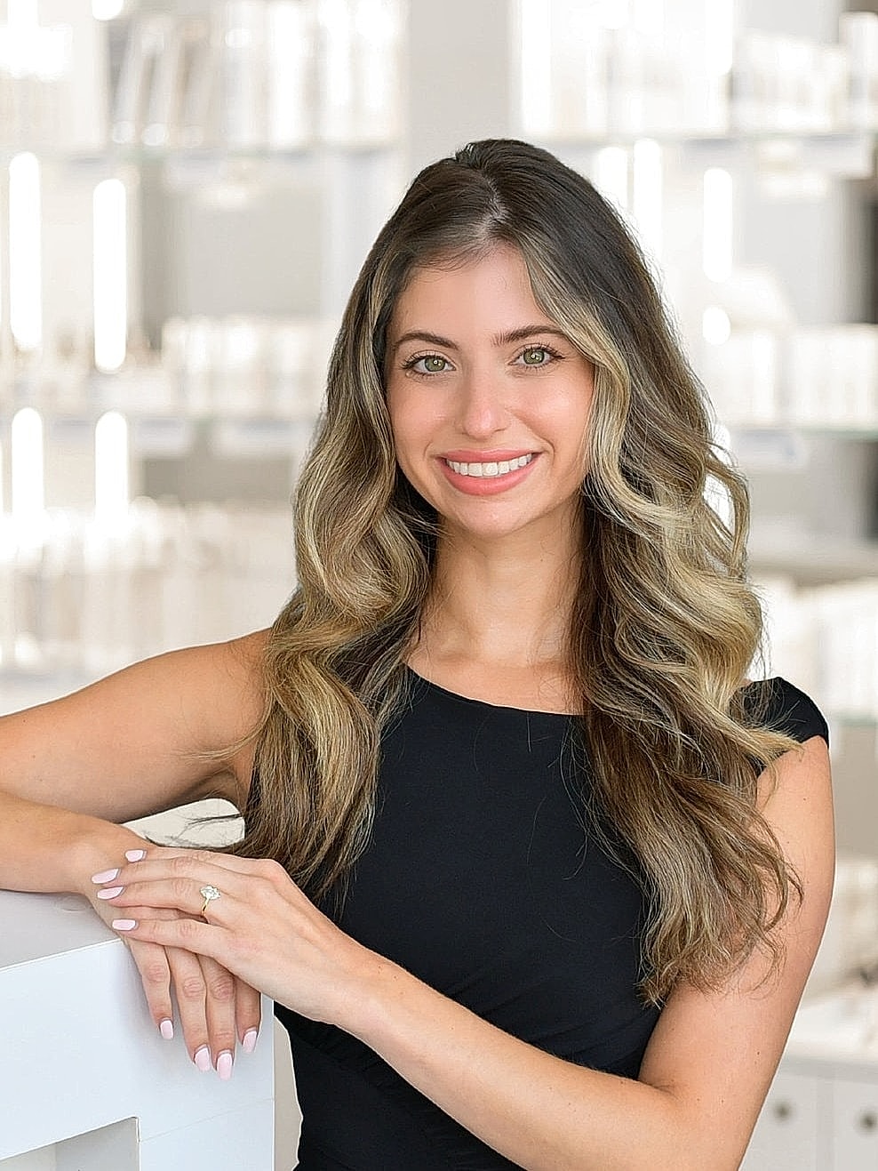 Smiling woman in salon with stylish background.