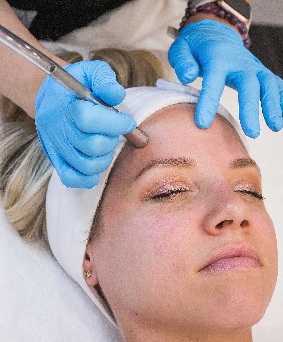 Facial treatment in progress with professional care.