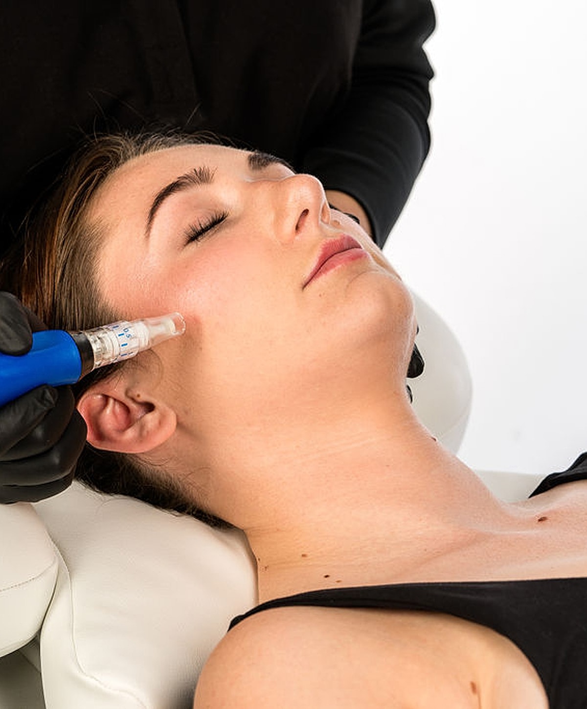 Black and white portrait of a woman in shirt.
