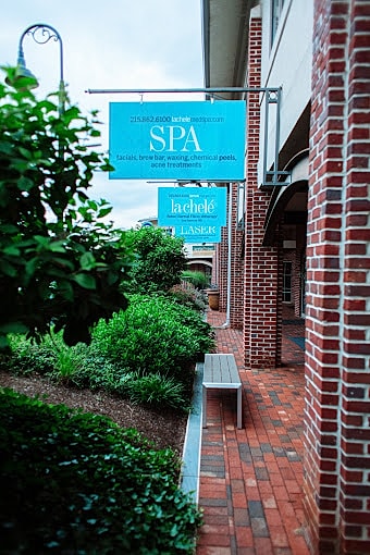 Signage for spa and laser treatments outside.