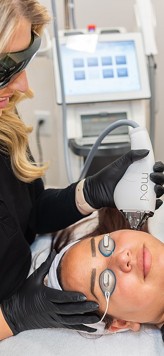 Laser treatment session in a skincare clinic.