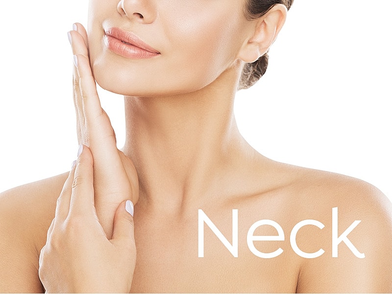 Woman gently touching her neck with soft smile.