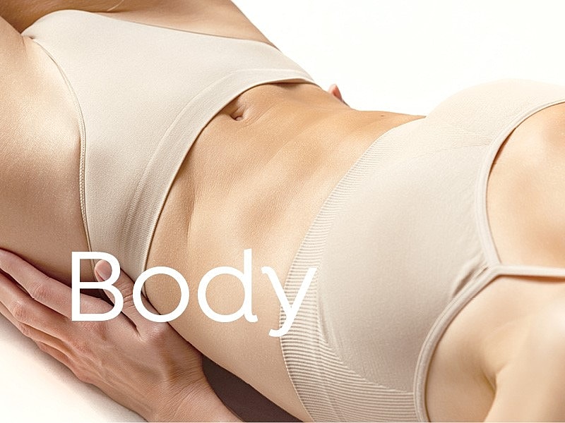 Body wearing beige lingerie, showcasing skin tone.