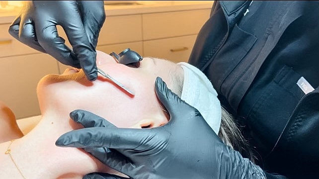 Skincare treatment in progress with professional tools.