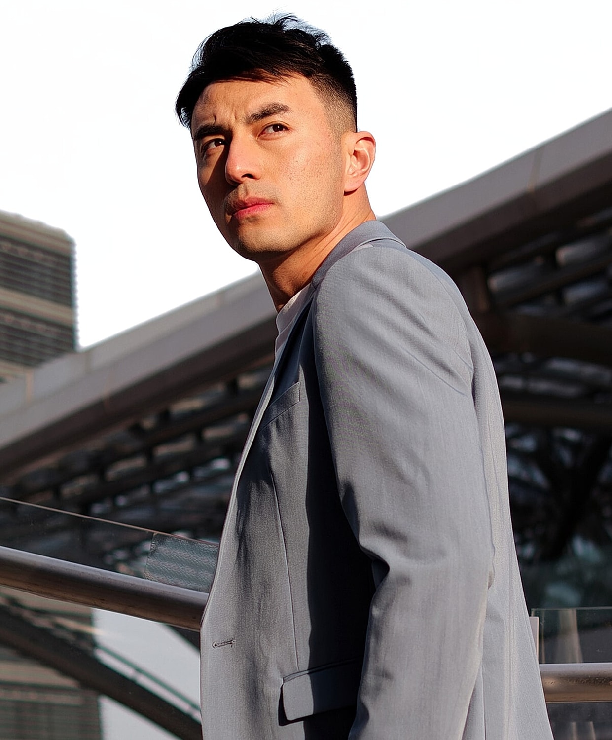 Man with styled hair and natural makeup.