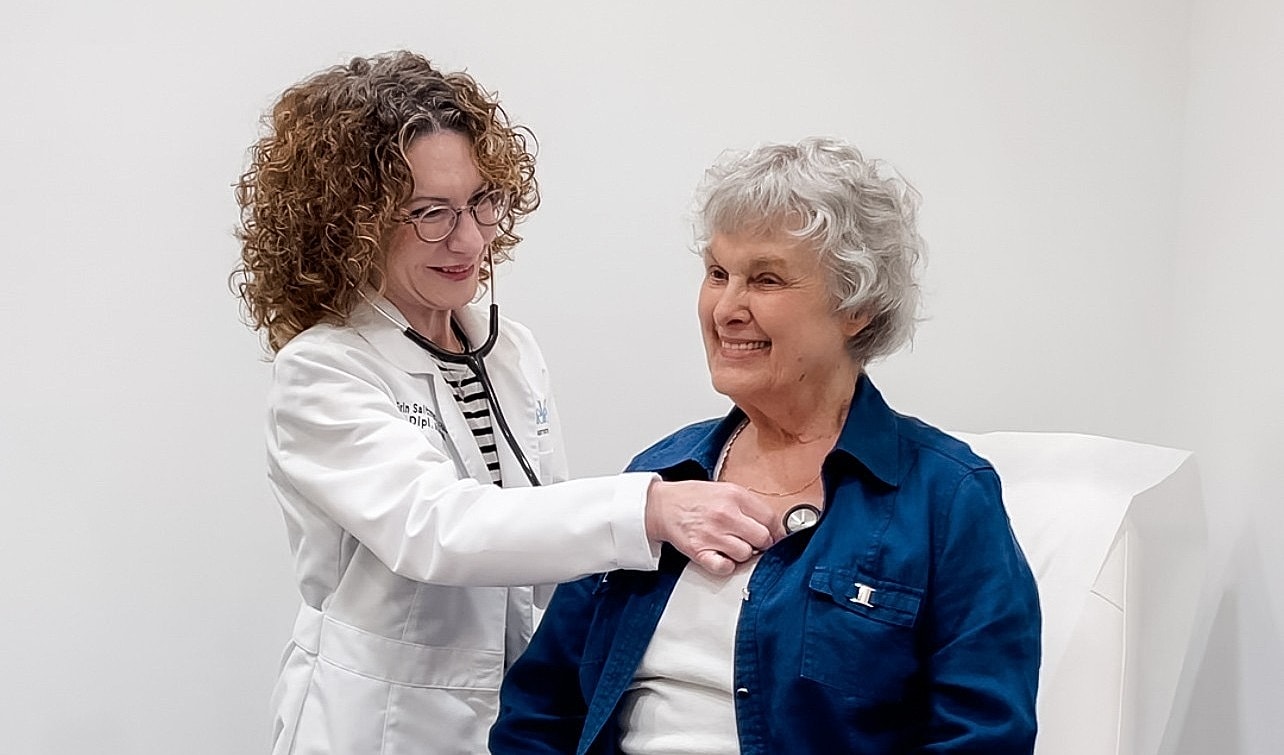 Clean medical examination room with treatment chair.