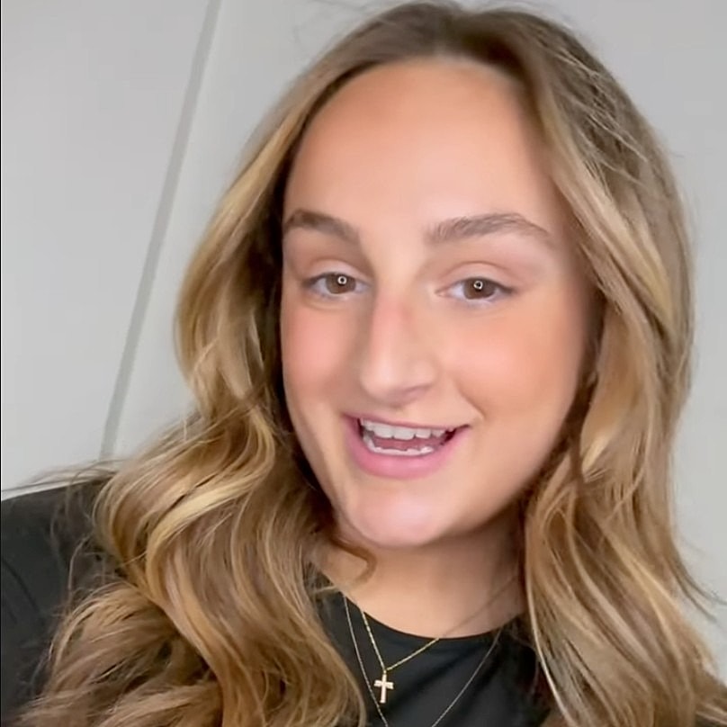 Applying skincare treatment to upper lip area.