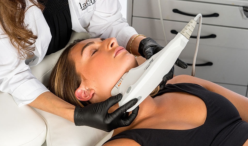 Woman with closed eyes and head tilted back.