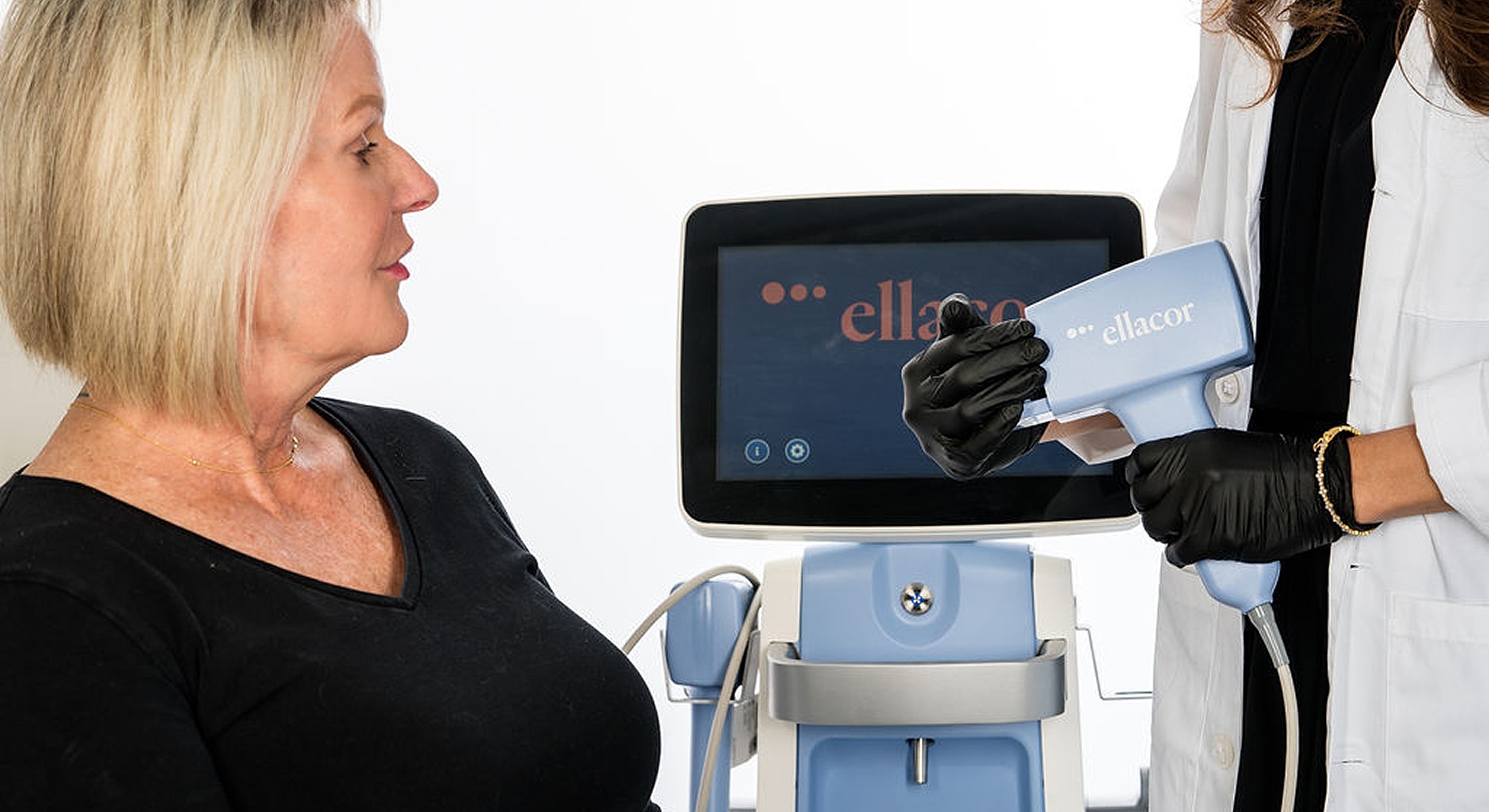 Woman receiving facial treatment with professional tools.
