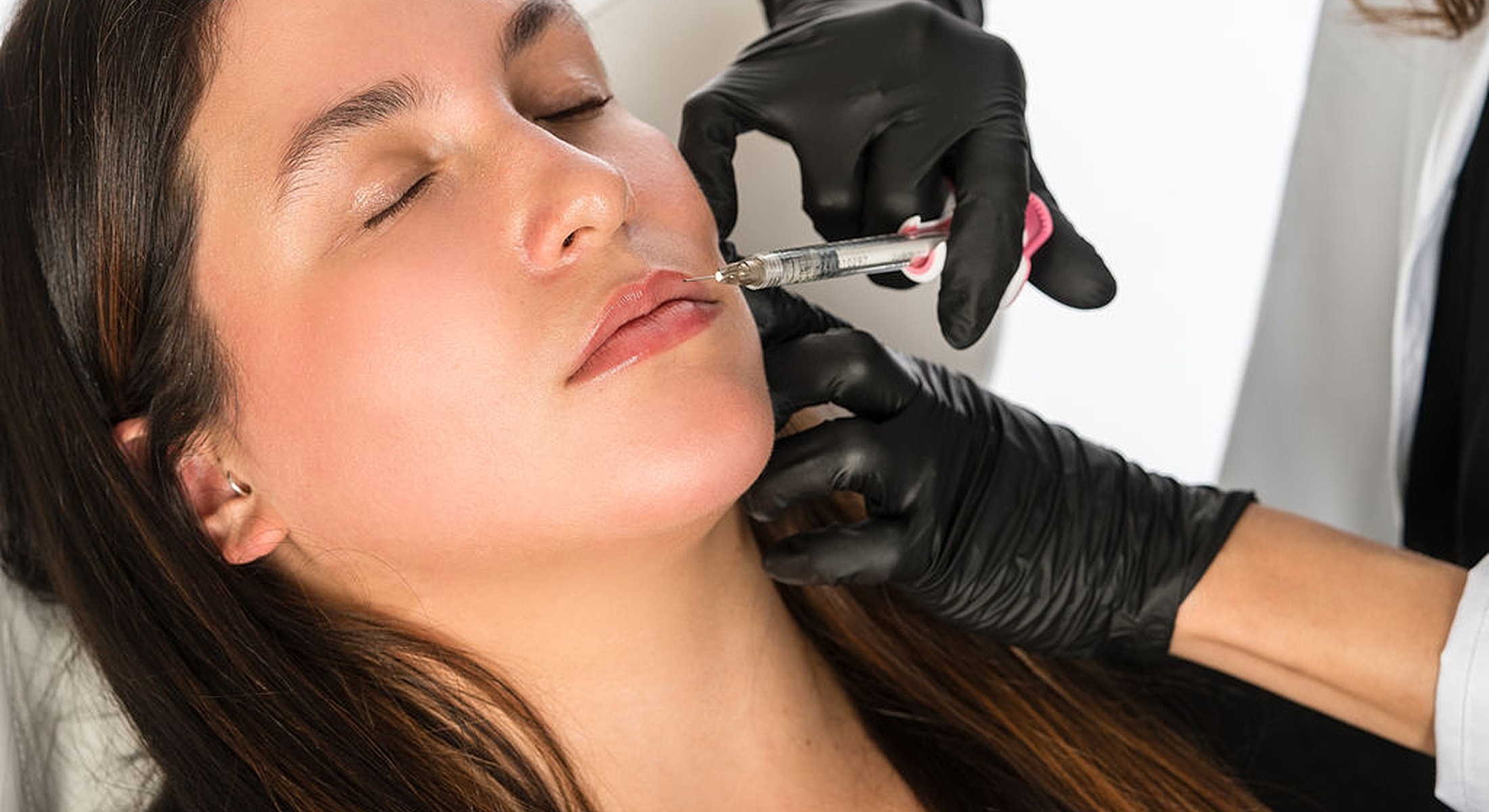 Administering cosmetic treatment in a clinical setting.