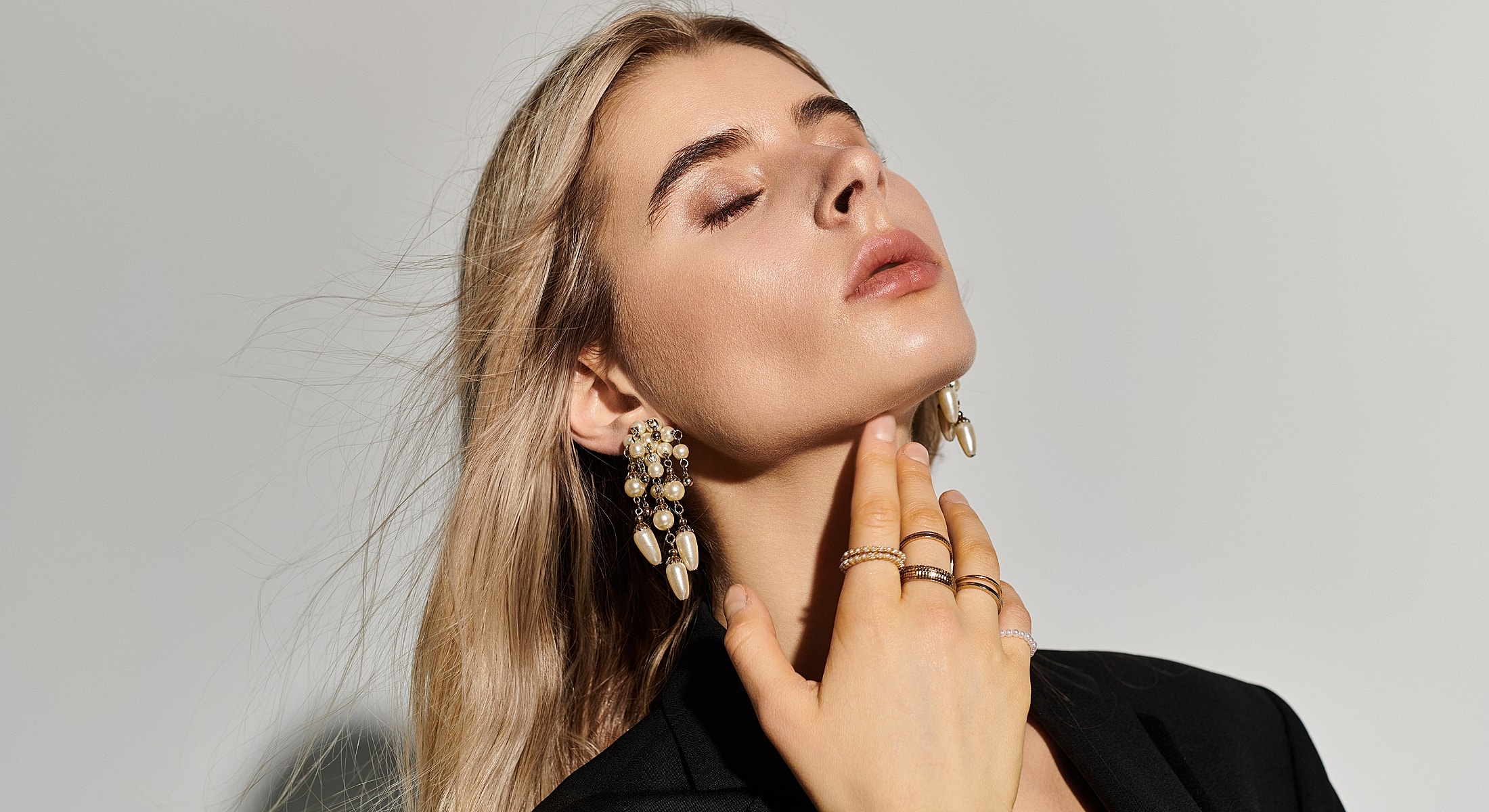 Model in black crop top and bikini bottoms.