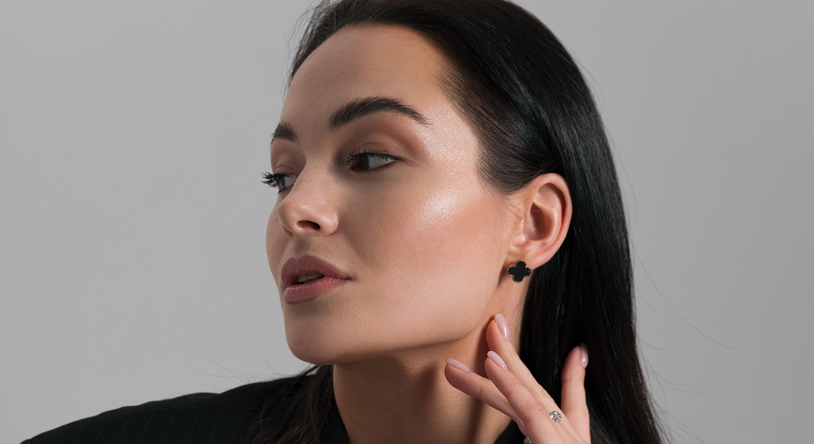 Profile of a woman with elegant earrings.