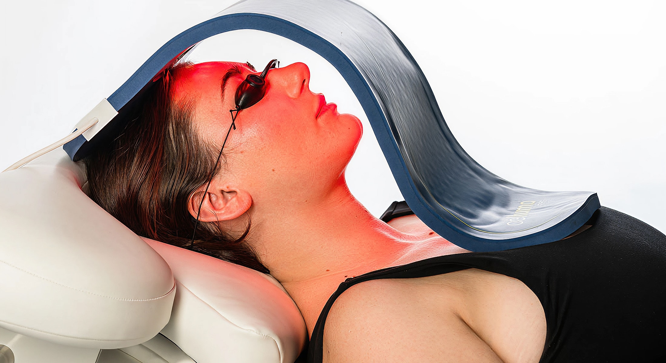 Woman undergoing light therapy treatment.