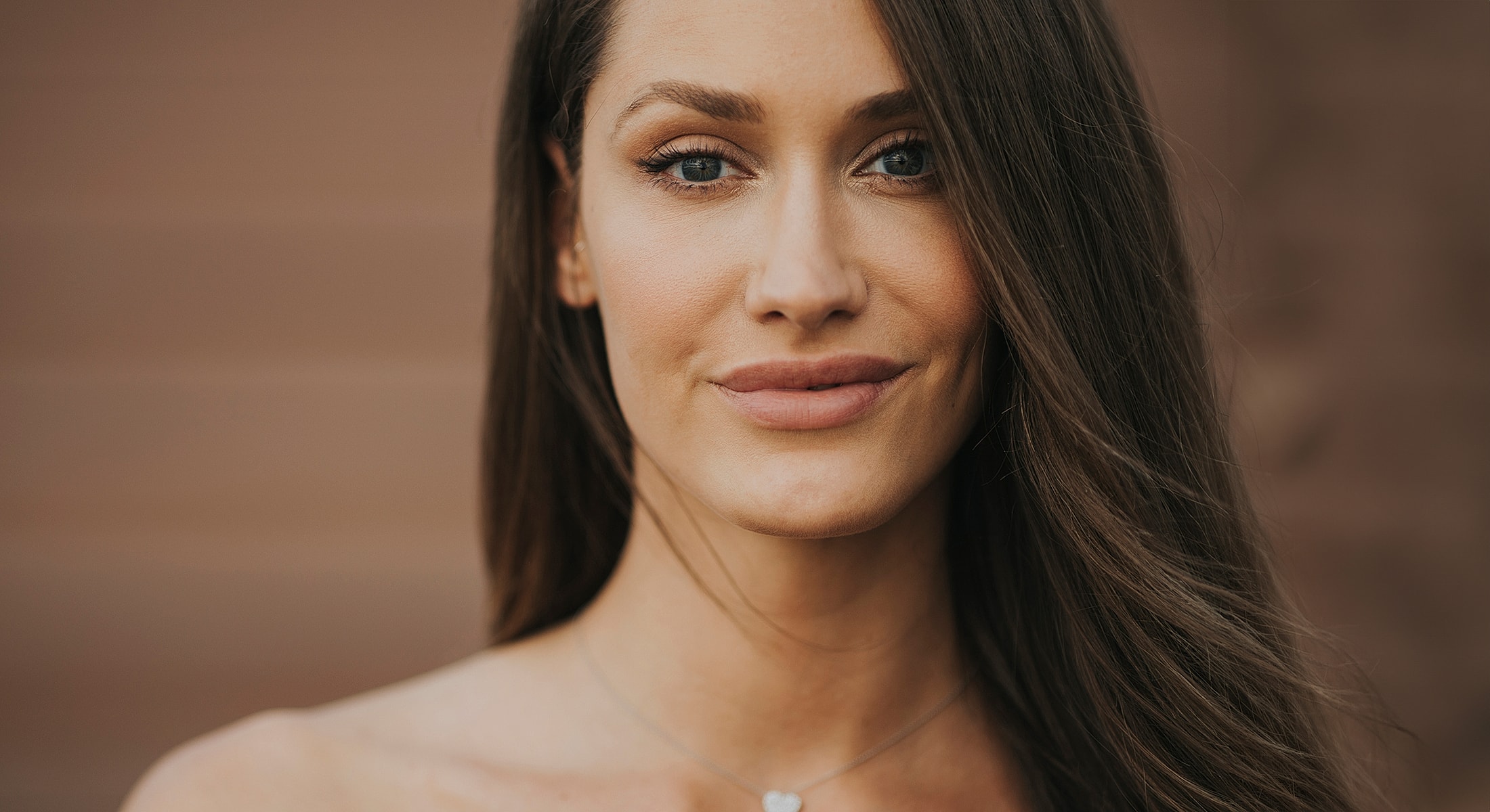 Close-up portrait of a woman with long hair.