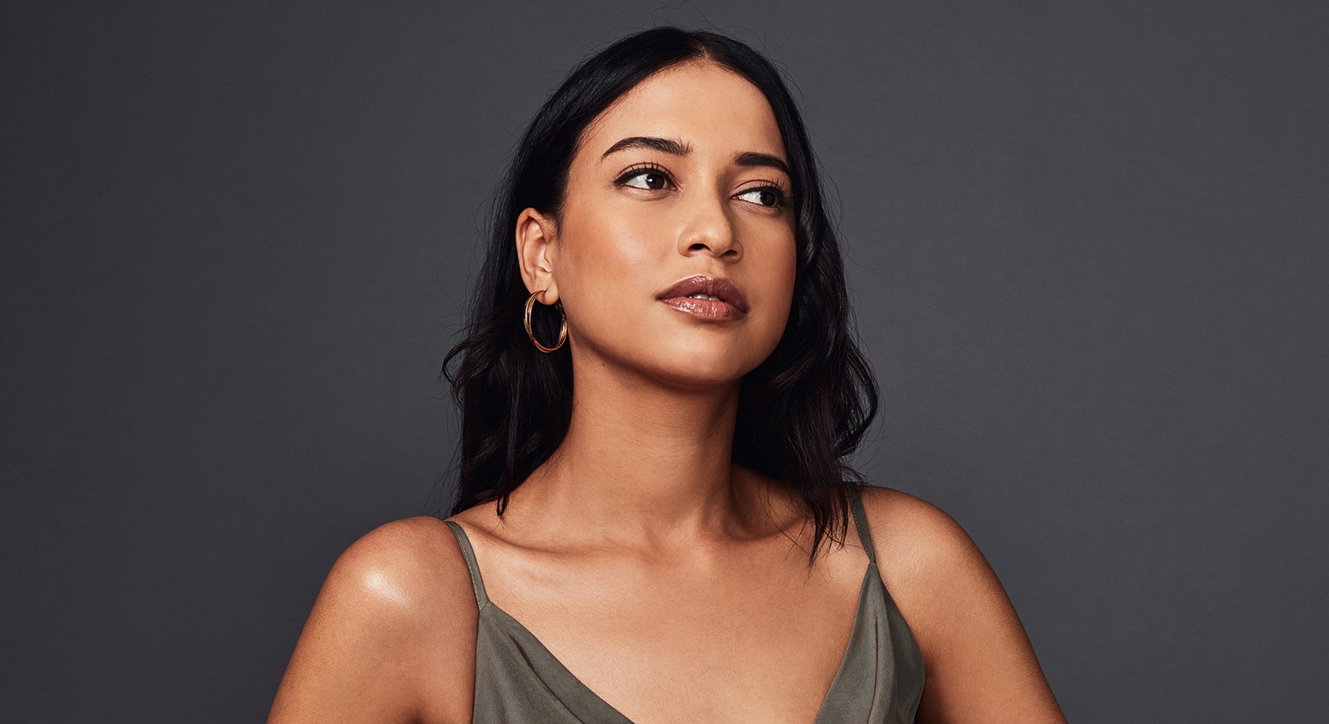 Portrait of a woman with long, dark hair.